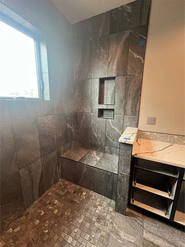 Bathroom project by Barron's Flooring & Home in Jackson, CA featuring Stone-look porcelain tile, Glass hexagon mosaic tile, Stone-look 2×2 mosaic porcelain tile