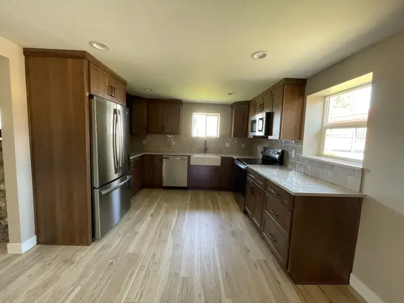 Kitchen project by Barron's Flooring & Home in Plymouth, CA featuring Kemper Rustic hickory cabinets, Marimac door, Kanga stain, Sensa Dakar 2cm quartzite, MSI Renzo square tile, Dove
