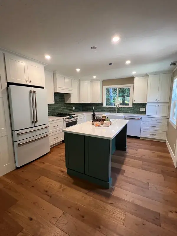 Kitchen project by Barron's Flooring & Home in Sutter Creek, CA featuring Kemper Maple cabinets painted White, Kemper Maple cabinets painted Retreat, Silestone Ethereal Glow 2cm quartz