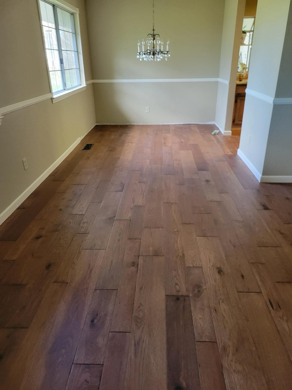 Rich hickory hardwood floor installed by Barron's in a Gold Country dining room