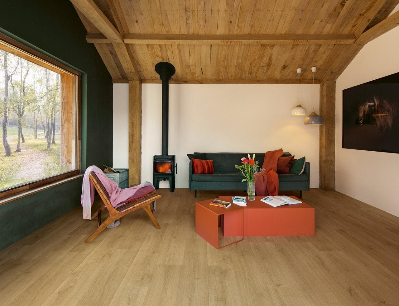 Quick-Step Capture wood laminate in a forest-cabin living room